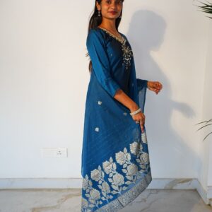 Teal blue kurta set with subtle neckline embroidery.